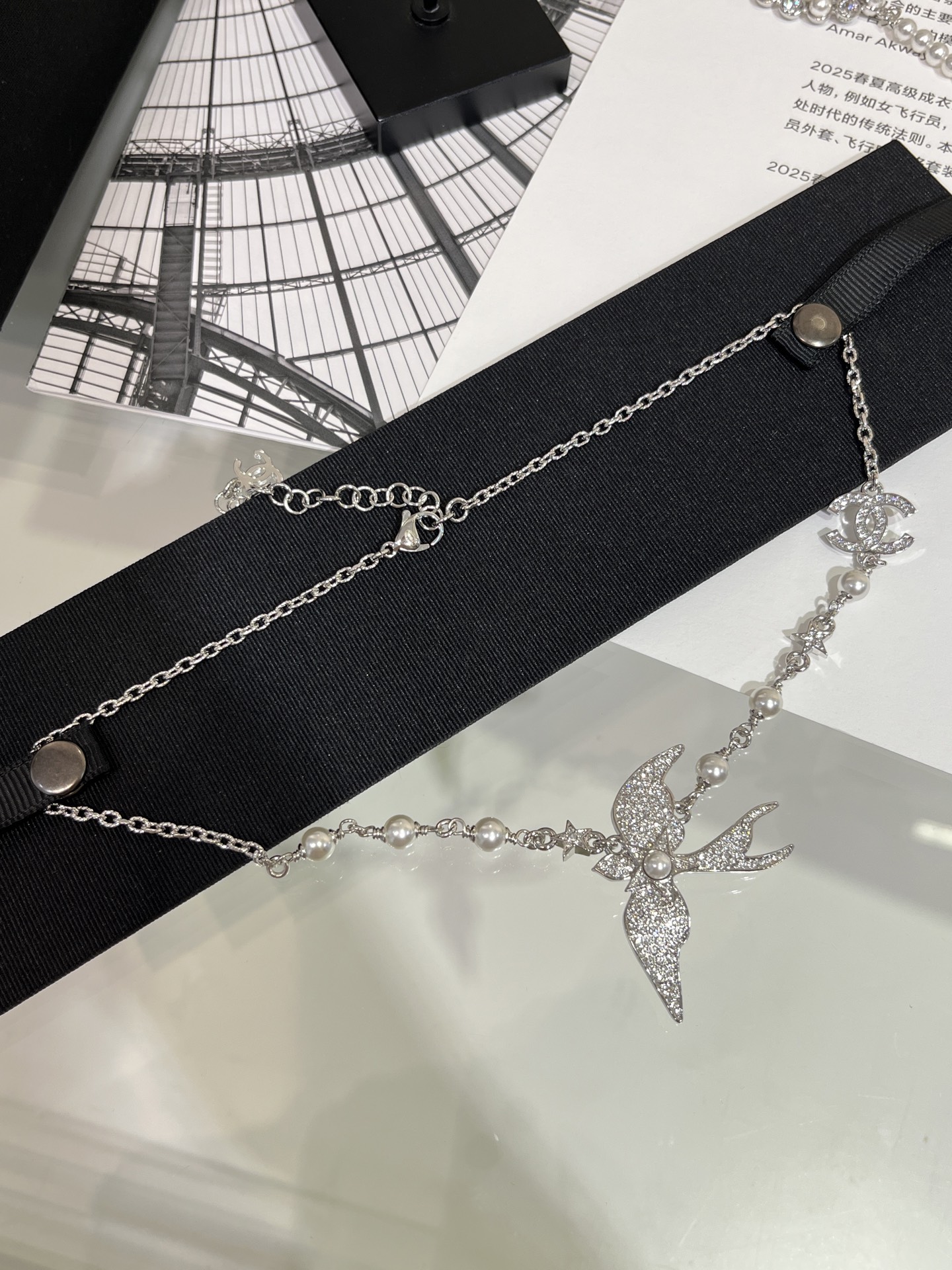 CHANEL 25S New Silver Bird-Inspired Double C Pearl Necklace