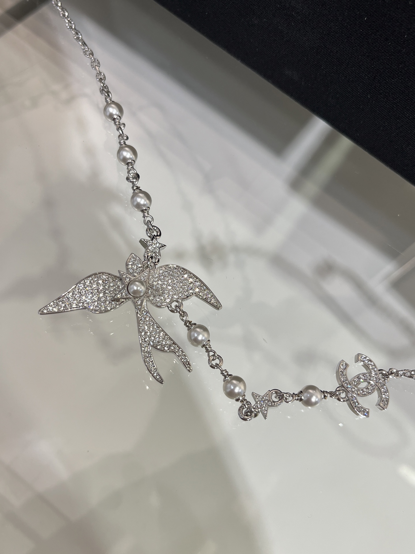CHANEL 25S New Silver Bird-Inspired Double C Pearl Necklace